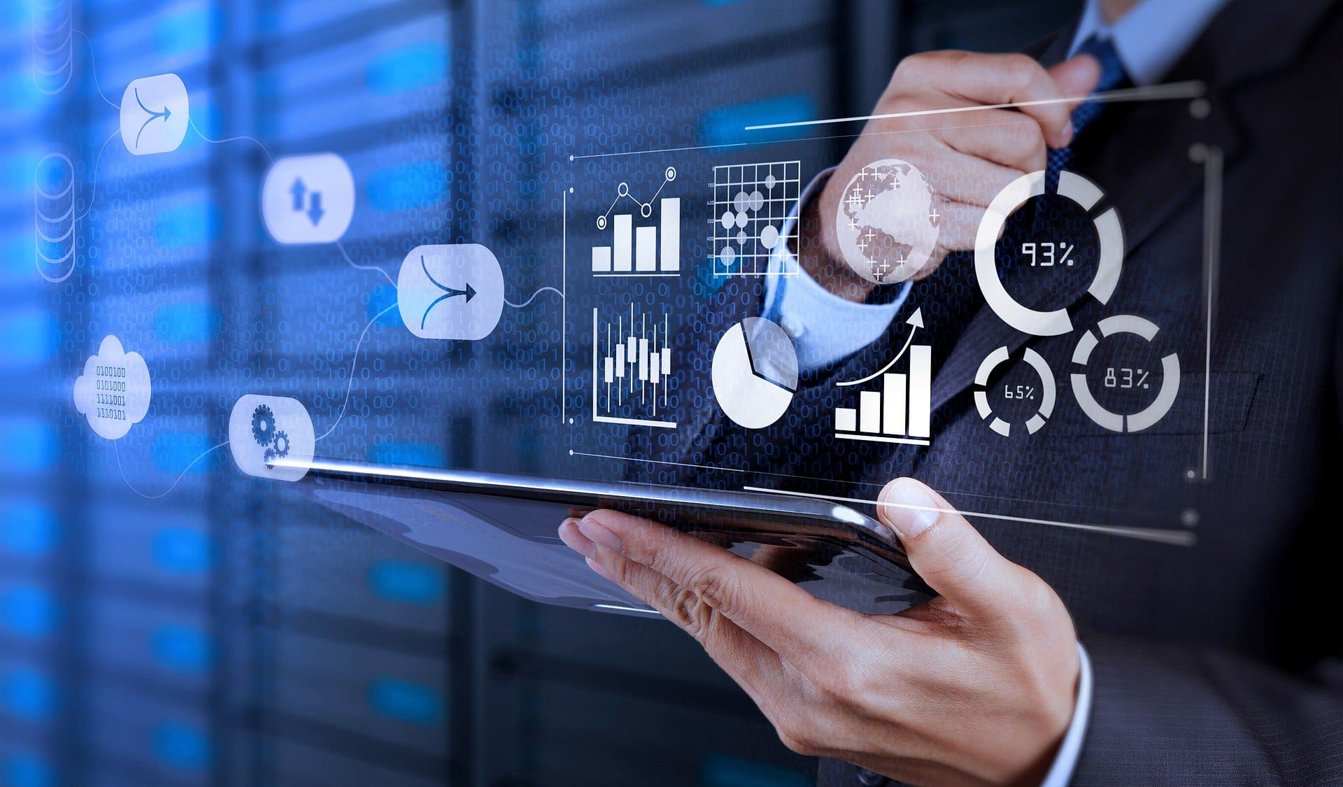 Digital Marketing - Person analyzing data on a tablet with futuristic digital graphs and charts overlay.